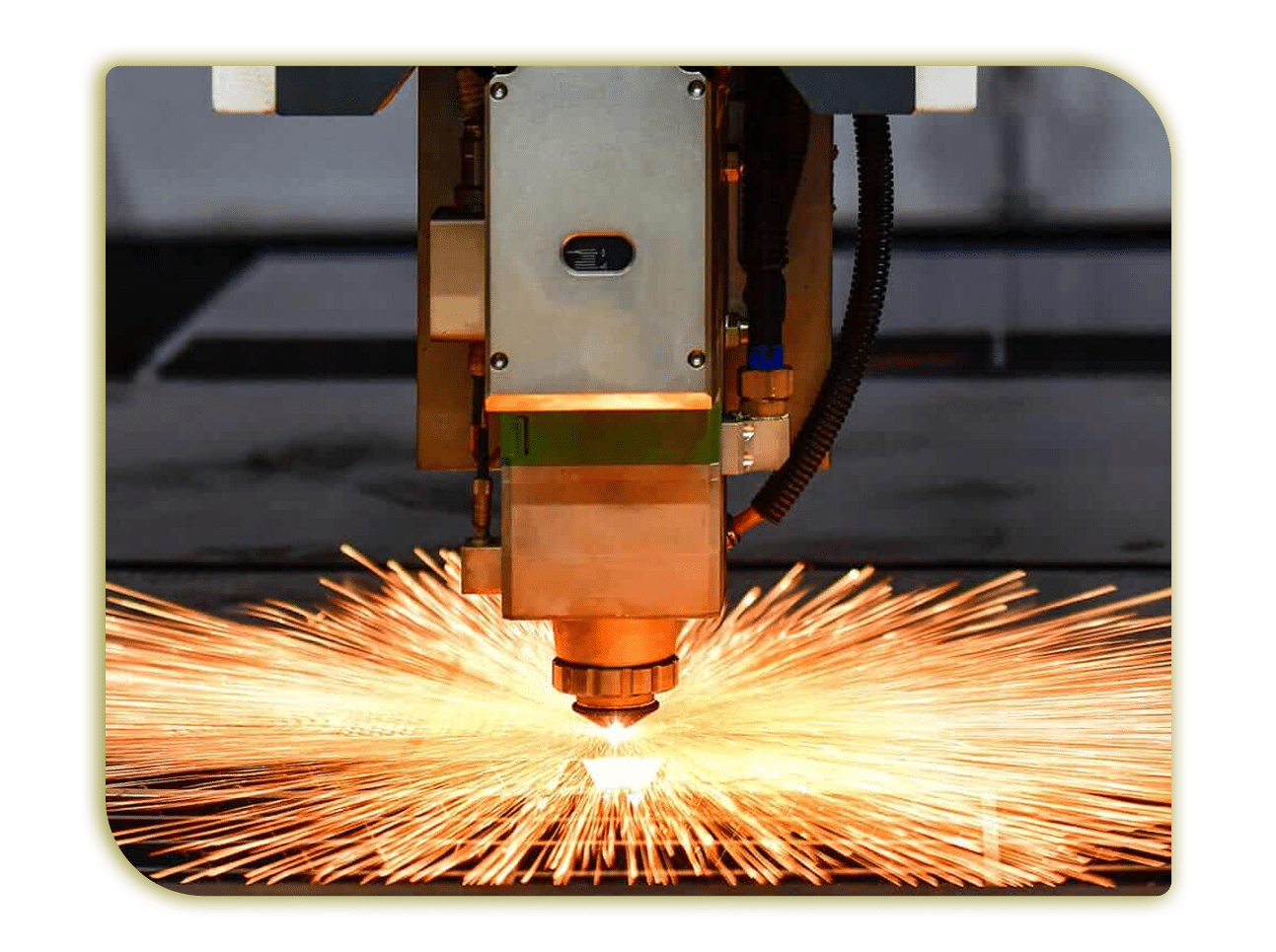 Laser cutting process with bright sparks and precision engineering in an industrial workspace   MunchMakers